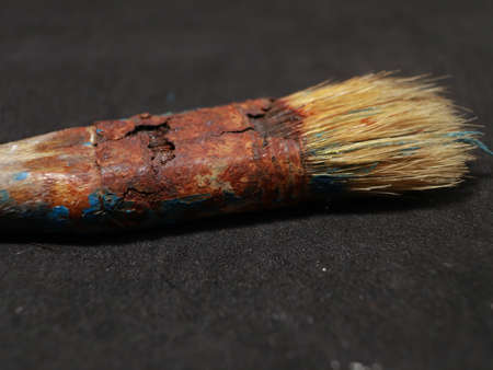 brush paint used condition with dirty brush and rusted brush holderの写真素材