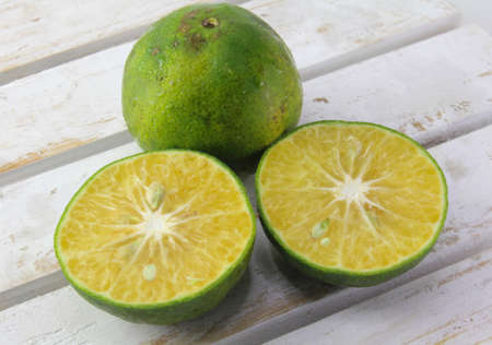 Green oranges and sliced Health fruit for clean food. High vitamin C.