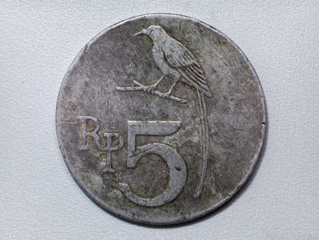 Old vintage Indonesia coin 5 rupiah with bird picture
