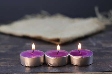 burning candle photo studio gold light of purple candleの写真素材
