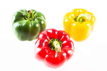 Three bell pepper is wet isolated on white backgroundの写真素材