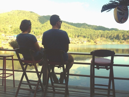 Couple enjoying the view by the lake  の素材