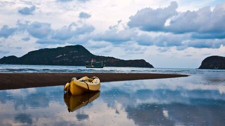 A  reflection of a yellow Boatの写真素材