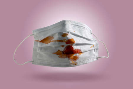 Littering Prevention the used surgical mask into the garbage.Medical waste pollution.