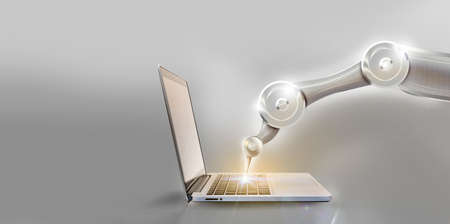 automation arms typing on laptops keyboard.
