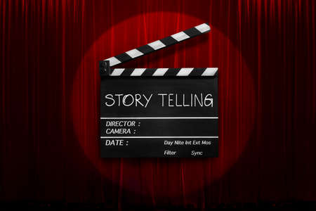 storytelling, text title on movie Clapper board or film slate and theatre curtains background.の写真素材