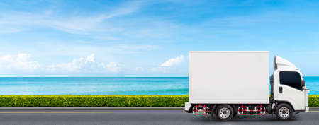 small white truck for seafood delivery Driving on the beach road Fast and eco-friendly freight forwarding concept.の写真素材