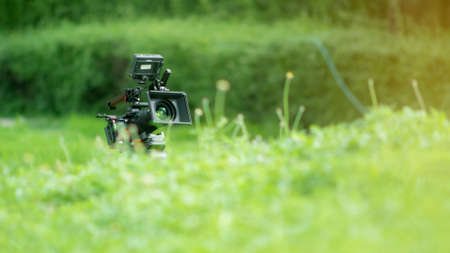 a movie camera or documentaries equipped with monitors for cinematographers. and a boom mic for...