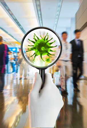 3D rendering of green virus from a magnifying glass at the airport terminalの写真素材