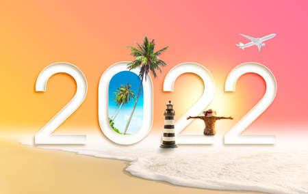 Happy new year 2022. Happiness women on the beach and travel summer destinations by airplaneの写真素材