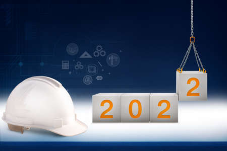 years 2022. stenciled letters in the concrete cube and Lifting by crane construction for preparation...