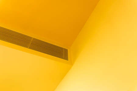 Ceiling concealed air duct in the orange roomの写真素材