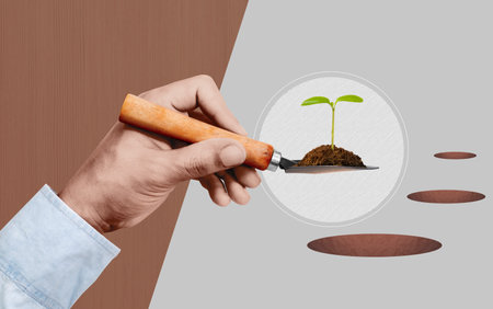 Businessman's hand is using a shovel to plant a tree.Community responsibility.の写真素材