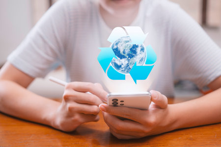 A young man uses a smartphone to search for ways to reduce waste to zero. Global warming, garbage...