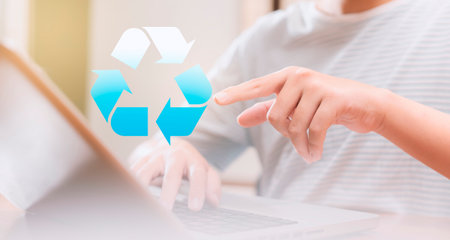Teenage boy touching recycle symbol for zero waste. sustainable future, environmentally, socially accountable, and smarter. Vision and technology to enhance education.の写真素材