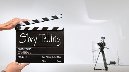 Story telling, Handwriting on film slate or clapperboard .film crew holding film clapperboard and a...