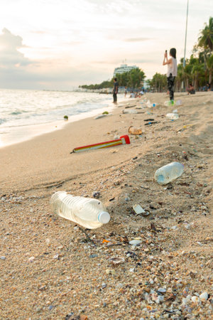 Plastic bottle on the beach. Pollution of environment concept.の写真素材