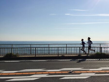 Jogging at the beach kanagawa japanのeditorial素材