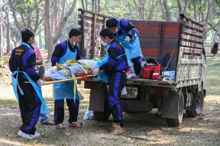 Emergency Medical team lifting traumatic patientのeditorial素材