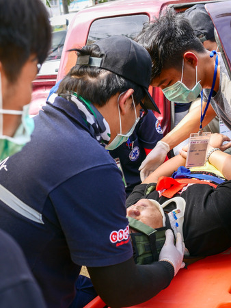 Emergency Medical team moving traumatic patient from car accident by using  Kendrick extrication deviceのeditorial素材