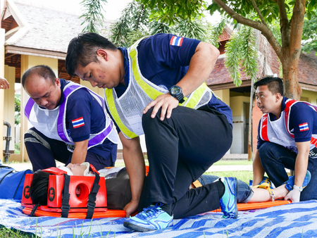 Emergency medical technicians are transporting the traumatic patient from car accidentのeditorial素材