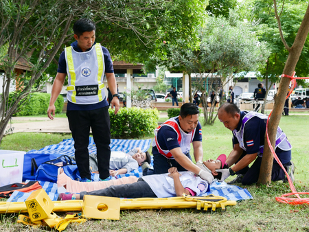 Emergency medical technicians are transporting the traumatic patient from car accidentのeditorial素材