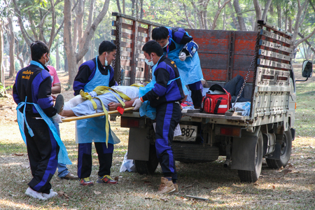 Emergency medical technicians are transporting the traumatic patient from car accidentのeditorial素材