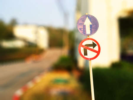 Do not turn right sign with straight ahead sign Into the government placeの写真素材