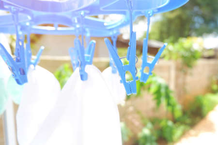 blue Circular cloth clamps is can grab a lot of clothesの写真素材