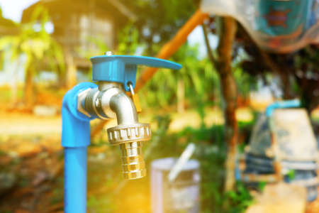 new outdoor blue Faucet with Locked padlock To prevent the use.の写真素材