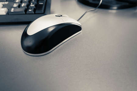 close up mouse on wooden desk for work with computerの写真素材