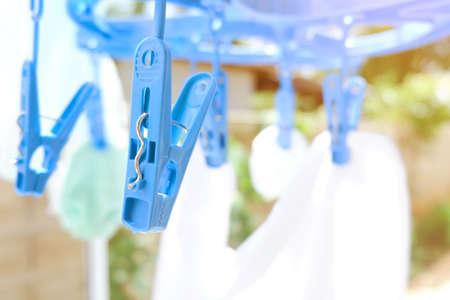 blue Circular cloth clamps is can grab a lot of clothesの写真素材