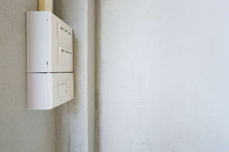 Switches and power outlets mounted on the wall.