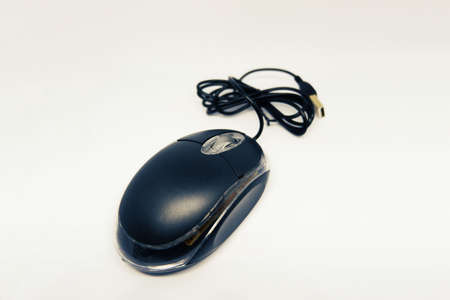 Black laser mouse with USB cable isolated on white backgroundの写真素材
