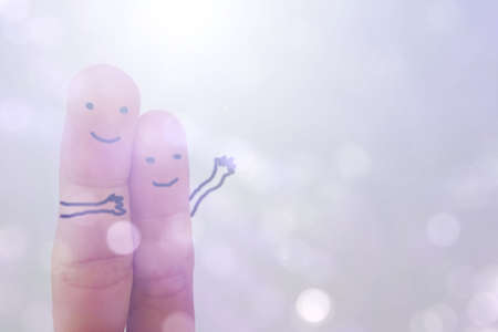 create idea concept of finger show Emotion in happy love Of lover in gesture hug together on bokeh backgroundの写真素材