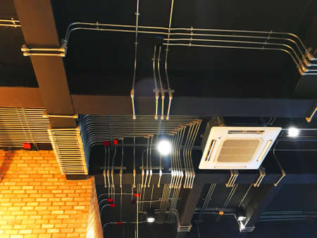 Electrical systems and air conditioning systems are installed on the ceiling.の写真素材