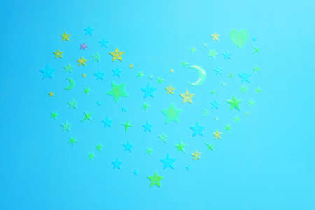 Decoration of light stars are Heart shaped on cement wall.の写真素材