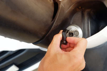 Use the hand to twist the motorcycle switch before startingの写真素材