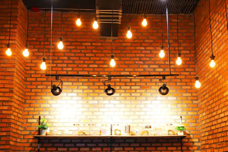 Decorating the room with brick walls with lamps is beautiful.の写真素材