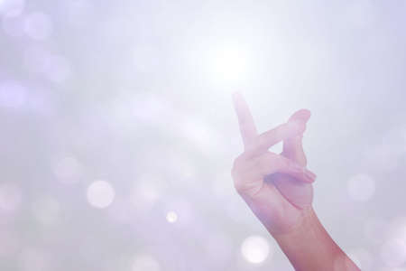 gesture of hand is show good idea snap finger isolated on bokeh backgroundの写真素材