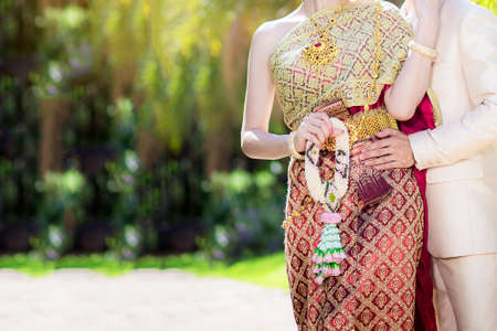 A couple in thai wedding costumeの写真素材