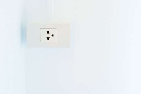 Outlet install on wall in new house with copy spaceの写真素材