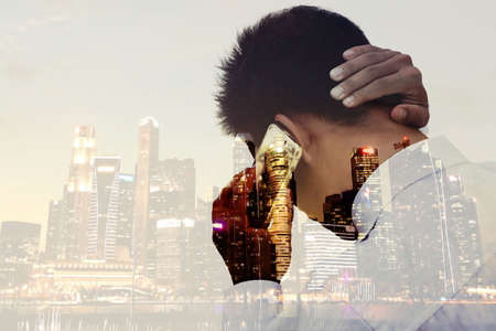 using smartphone for Communicate or Personal Use In the big city with double exposure concept idea.の写真素材