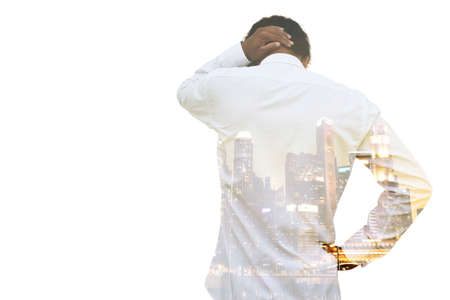 Concerns and problem of businessman and investors in big cities with city double exposure in bodyの写真素材