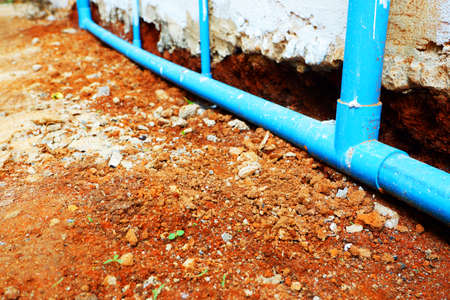 close up of PVC water pipes are installed behind the house.の写真素材