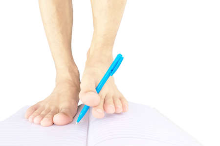 use foot for write on notebook of Disabled without arms isolated on white background