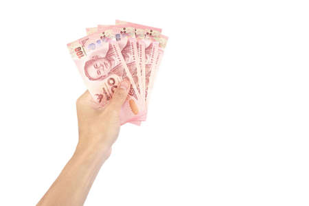 Thai baht cash money Banknotes are in hand of man isolated on white background