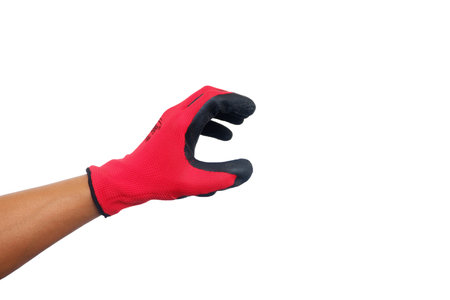 Hands of a man with gloves for pulling grass