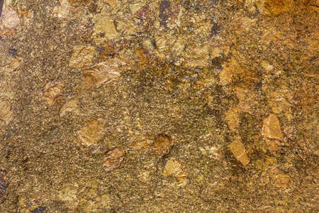 Golden Plate, Gold paper texture on Buddha sculptureの写真素材