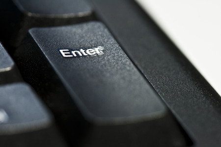 Closeup of enter botton on black keyboard